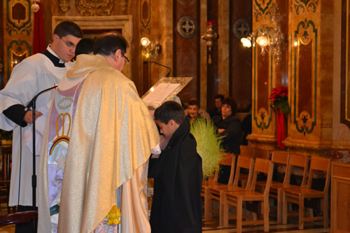 033 Denzil DeGabriele being invested as new altar boy