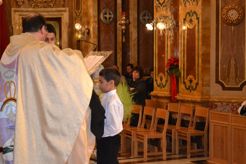 032 Denzil DeGabriele being invested as new altar boy