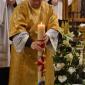 064 Deacon dipping the Paschal Candle in the water