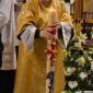 063 Deacon dipping the Paschal Candle in the water