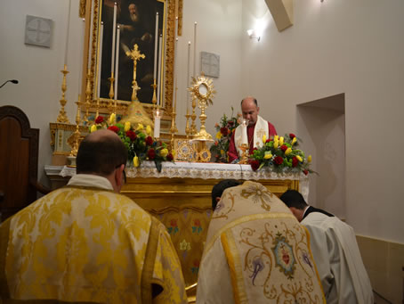 56 Heads bowed in front of the Blessed Sacrament