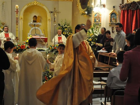 35  Celebrant sprinkling Holy Water on congregation