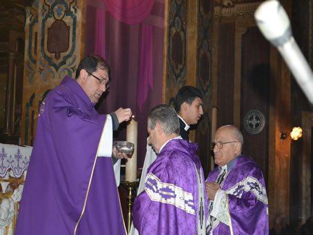 34 Placing ashes on priest's forehead