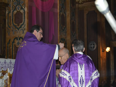 35 Placing ashes on priest's forehead