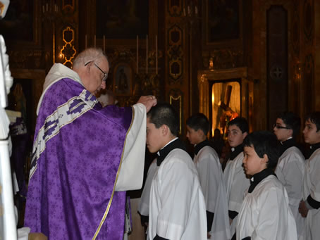 36 Placing ashes on altar boy's forehead