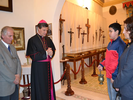 022 Bishop praying over the exhibits