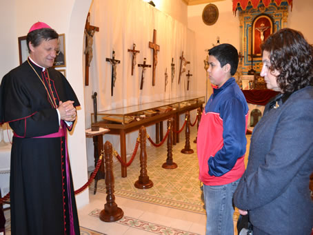 021 Bishop praying over the exhibits