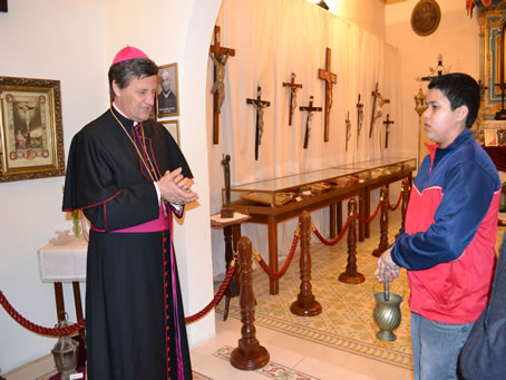 020 Bishop praying over the exhibits