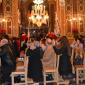 47 Members of Confraternity in background prepare for Procession