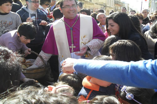 41 Distributing Easter Buns to children