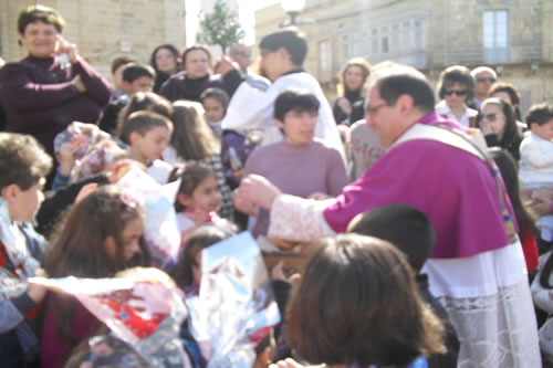 38 Distributing Easter Buns to children