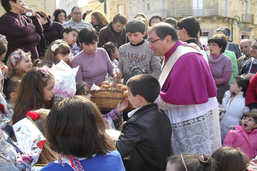 37 Distributing Easter Buns to children