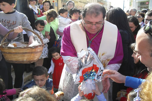 43 Distributing Easter Buns to children