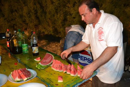 DSC_0247 Noel busy slicing water melons