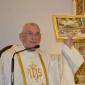 DSC_0076 The gift - a photo of Mgr Sultana in front of reliquary of St John Maria Vianney