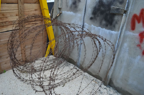 54 Refugees behind barbed wire