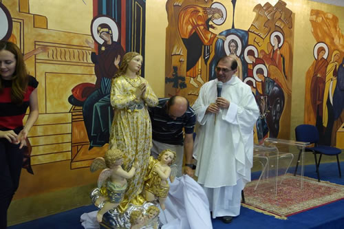 013 Archpriest admires the restored statue