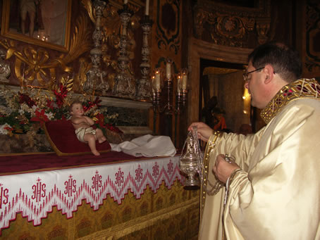 C1 Archpriest incensing the image of Baby Jesus