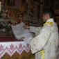 B8 Deacon Bajada approaches the covered statue of Jesus