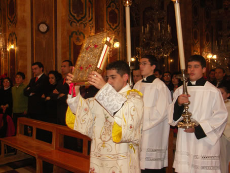 B1 Deacon A Bajada carries the Bible