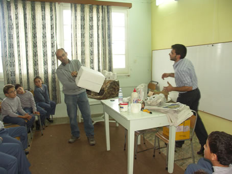 A3 Children shown how to use a cardboard box