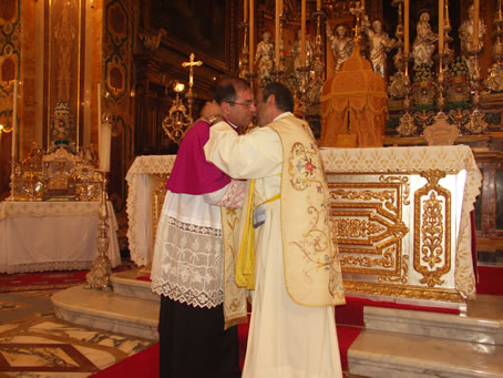 E9 Archpriest embraces Fr Said