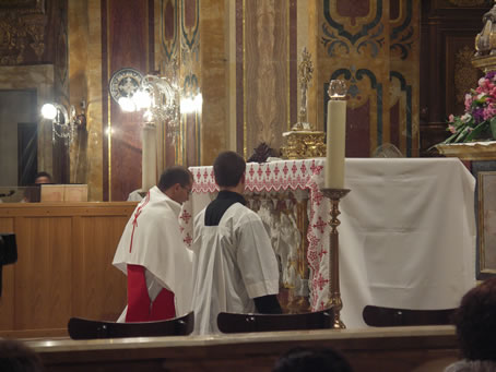 A3 Deacon Rev Richard N Farrugia prepares for Benediction