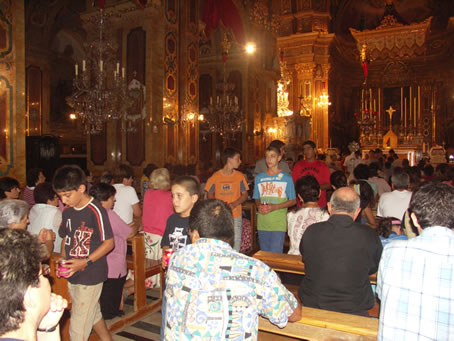 B6 Youths lead the procession carrying candles