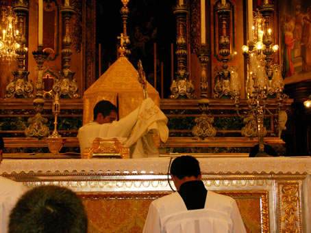 G1 Deacon Anthony Bajada imparts benediction with the Blessed Sacrament