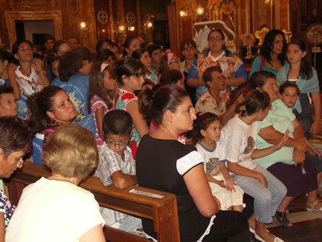 C2 Congregation waits the arrival of the statue in the nave