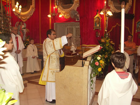 B7 Rev Deacon Farrugia incensing the missal