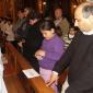 H8 A young congregant digs deep into her purse to make her offerings