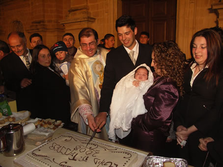 A8 cutting the cake with Thea asleep