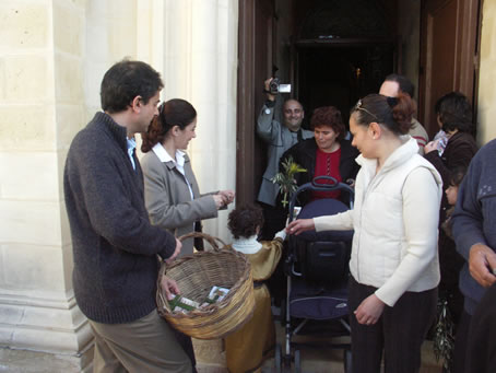 K6 handing out blessed palm crosses and olive leaves