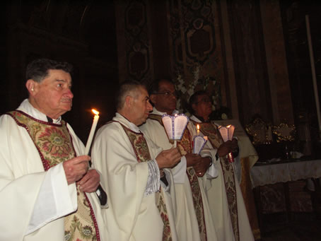 B8 Priests with lit candles