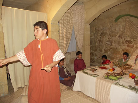 B5 Matthew hands pieces of bread to spectators