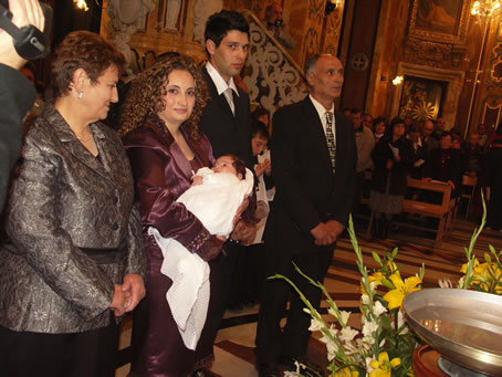 B8 Parents and godparents with baby